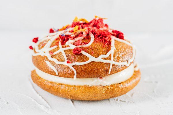 Raspberry and White Chocolate Whoopie Pie against a white background