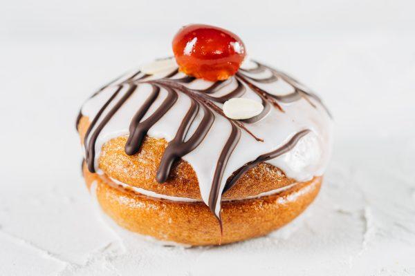 Cherry Bakewell Whoopie Pie. Almond sponge, marshmallow filling, blueberry jam, topped with icing, chocolate and a glace cherry