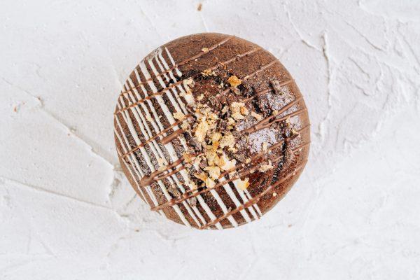 Cappuccino and Salted Caramel Whoopie Pie shot from above with a white textured background