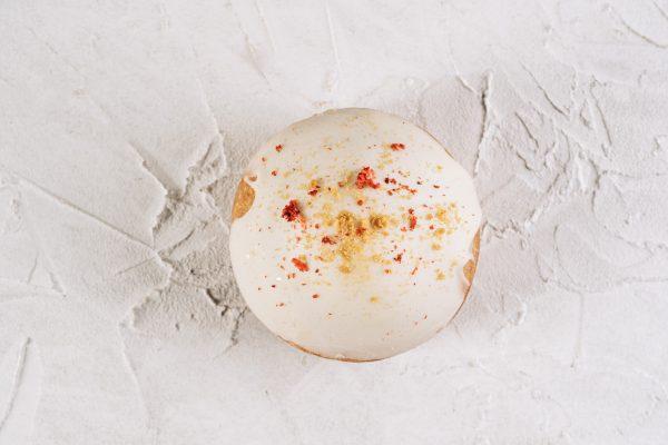 Strawberry Cheesecake Whoopie Pie shot from above on a white background